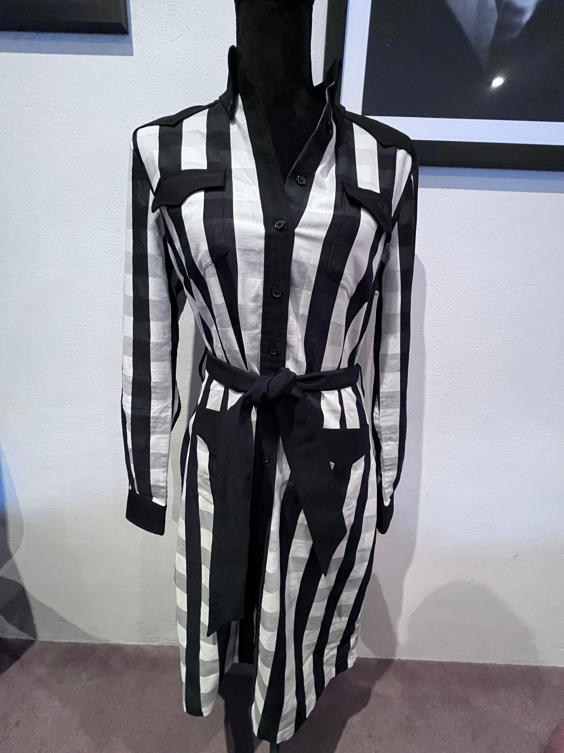 amy winehouse black and white dress New York, New York, USA. 11th Oct, 2021. Hugo Boss black and white striped mini dress worn by Amy Winehouse while performing ''Rehab'' on The Tonight Show with Jay Leno in 2007,
